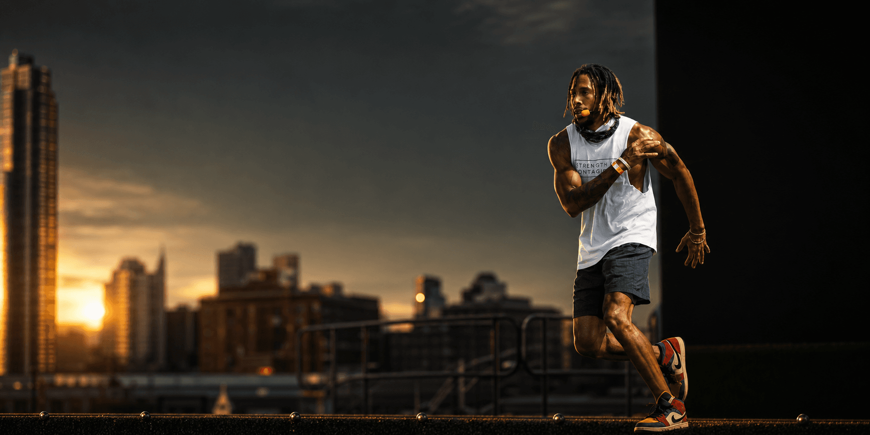 Flex training on a New York City rooftop at sunset